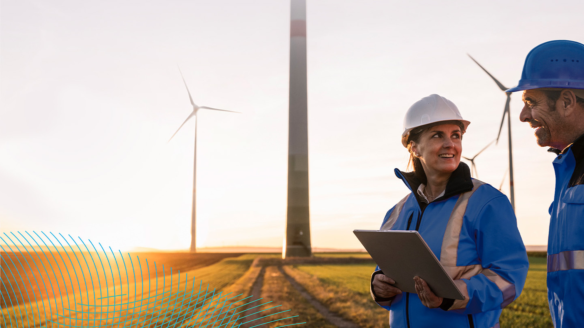 RWE employees in the field in front of wind turbines